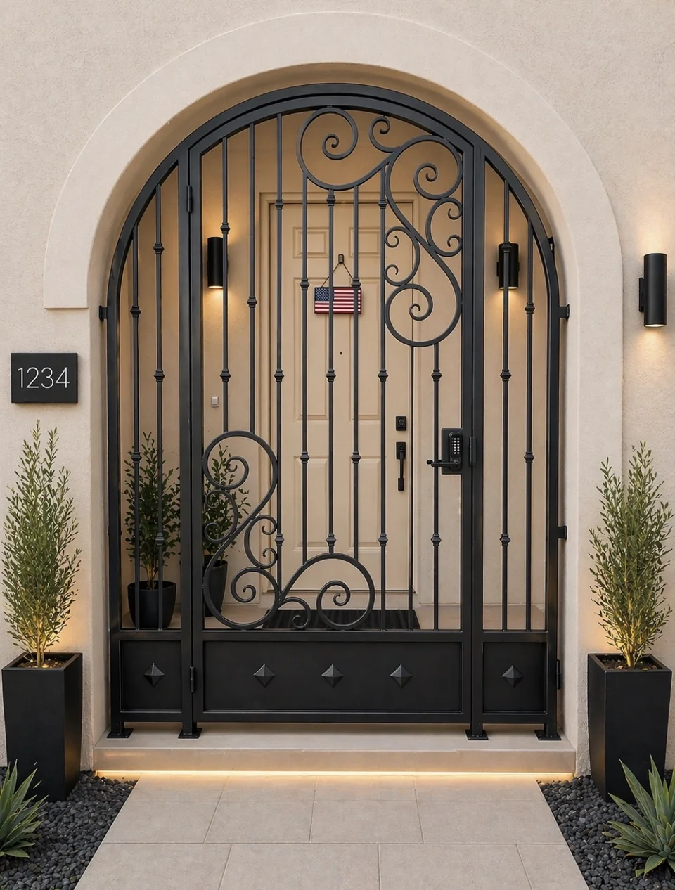 Olson Iron custom courtyard entry gate in Las Vegas — Arched scroll iron entry gate with center scroll medallion and code lock at warm-stucco arched courtyard (822G)