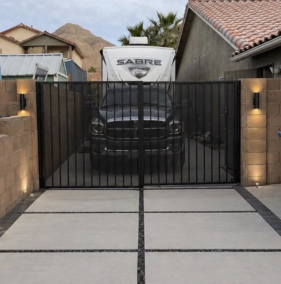 Olson Iron custom RV / driveway gate in Las Vegas — black arched double rv gate with decorative pickets and paver apron in Las Vegas (717G)