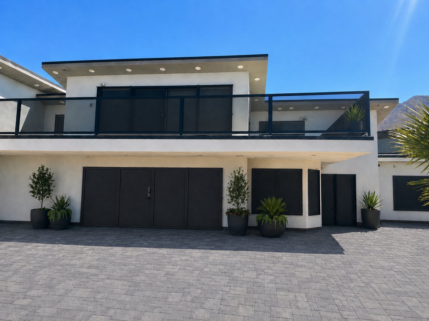 Desert-modern Las Vegas home with Olson Iron security screen doors, security screen windows, and second-story rails