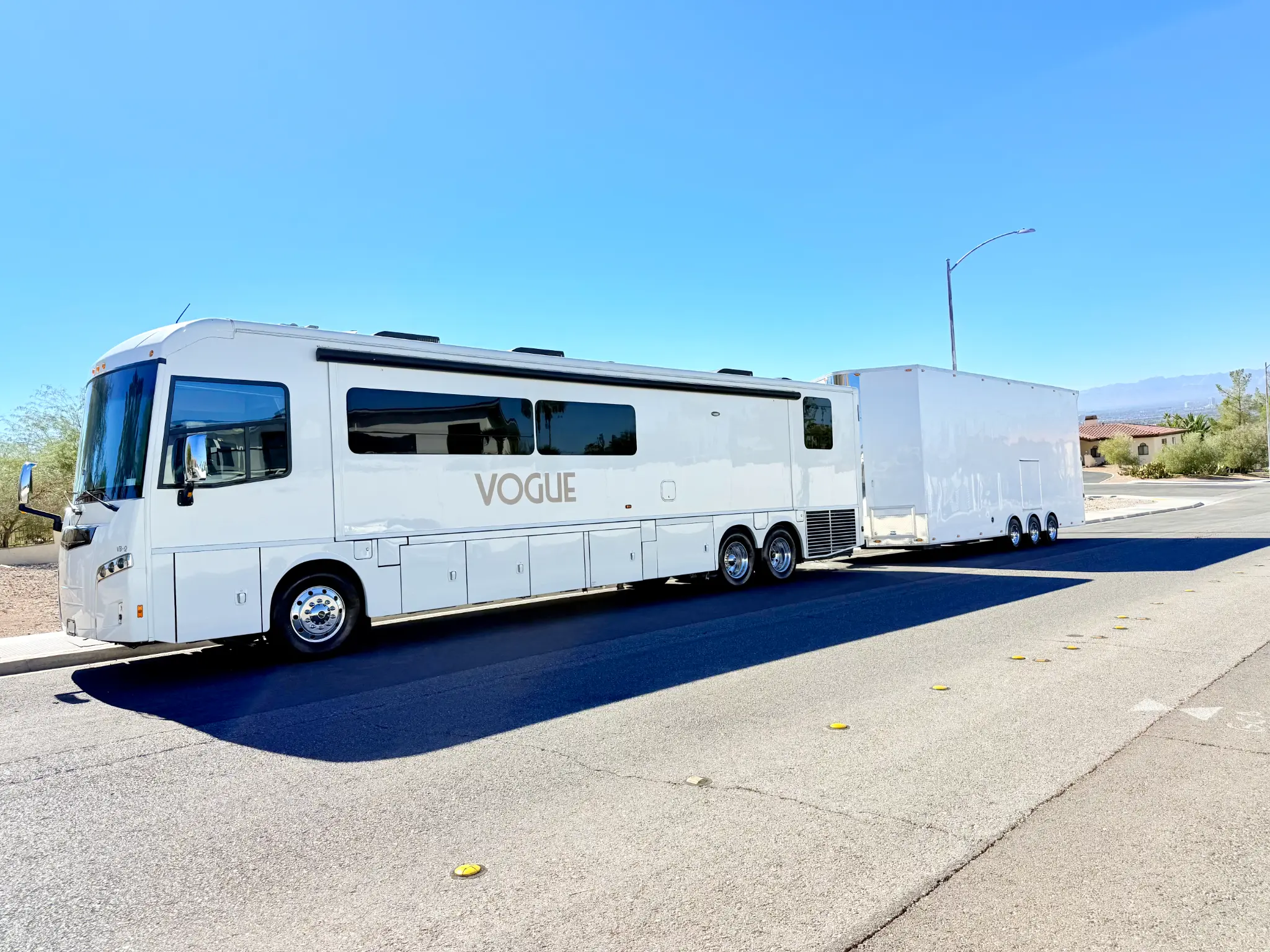The Olson Iron motorhome and trailer on the road to the dunes
