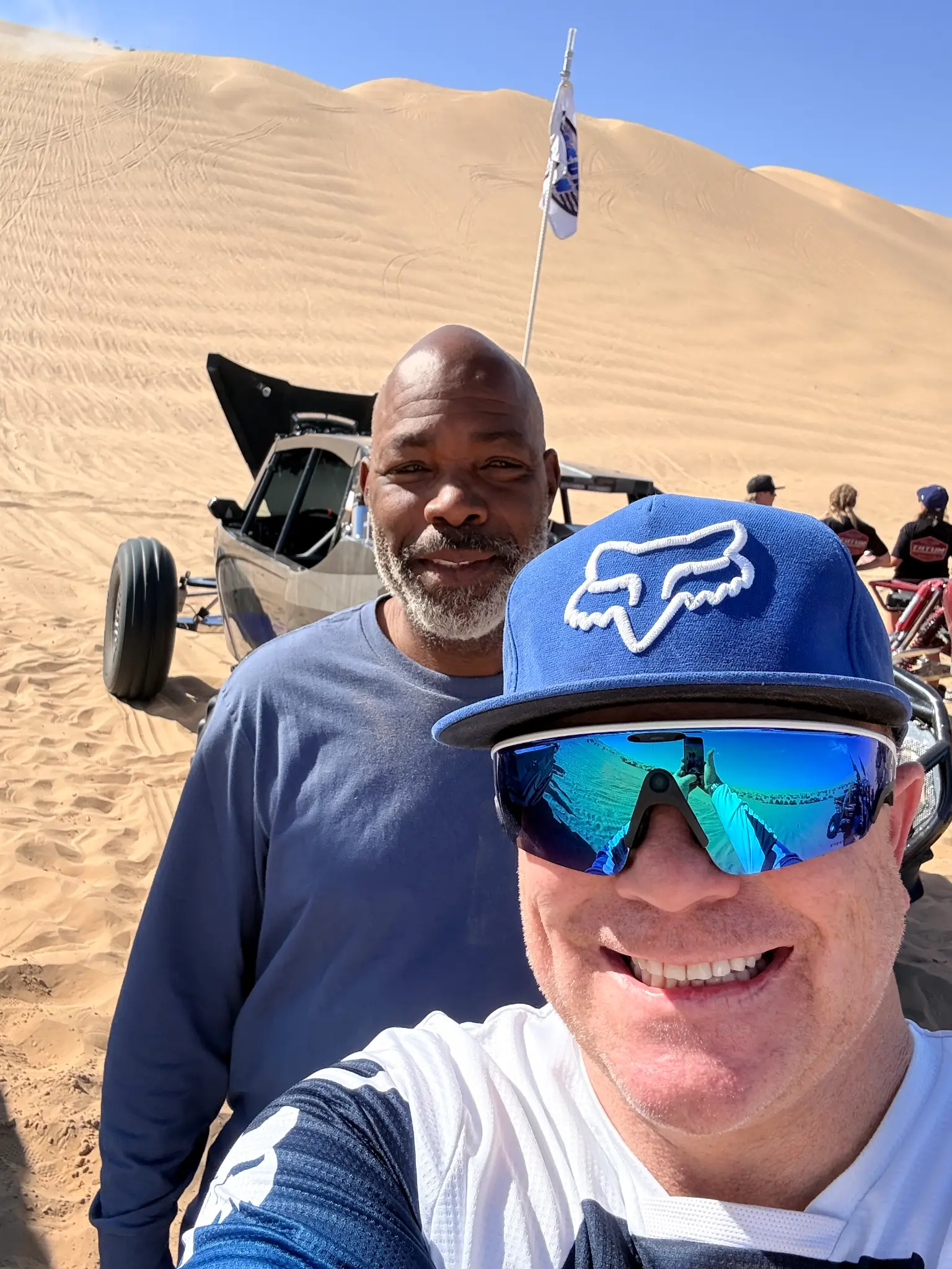 Bo Olson and crew member at the dunes