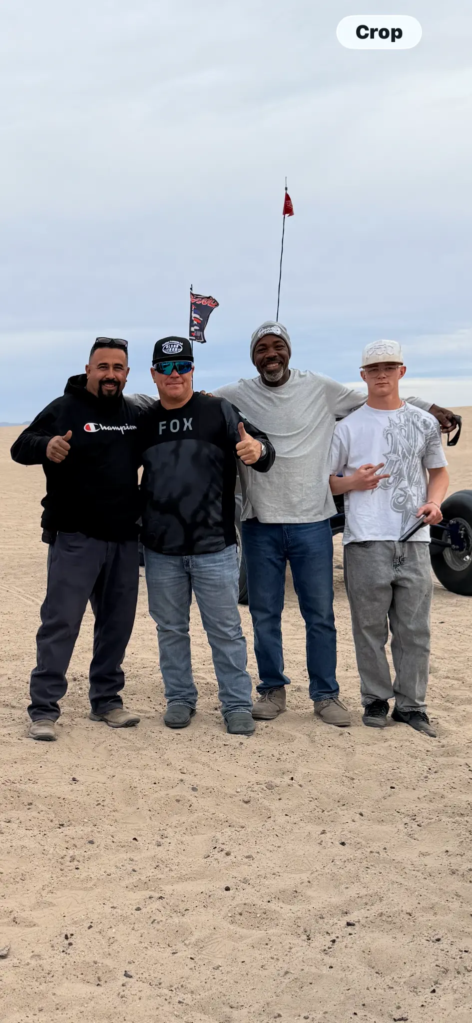 Four Olson Iron crew members at the dunes