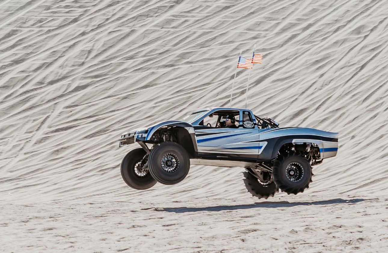 Olson Iron sand truck airborne over the dunes