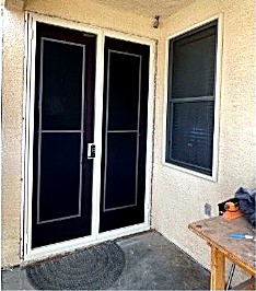 Existing dual-door opening on stucco