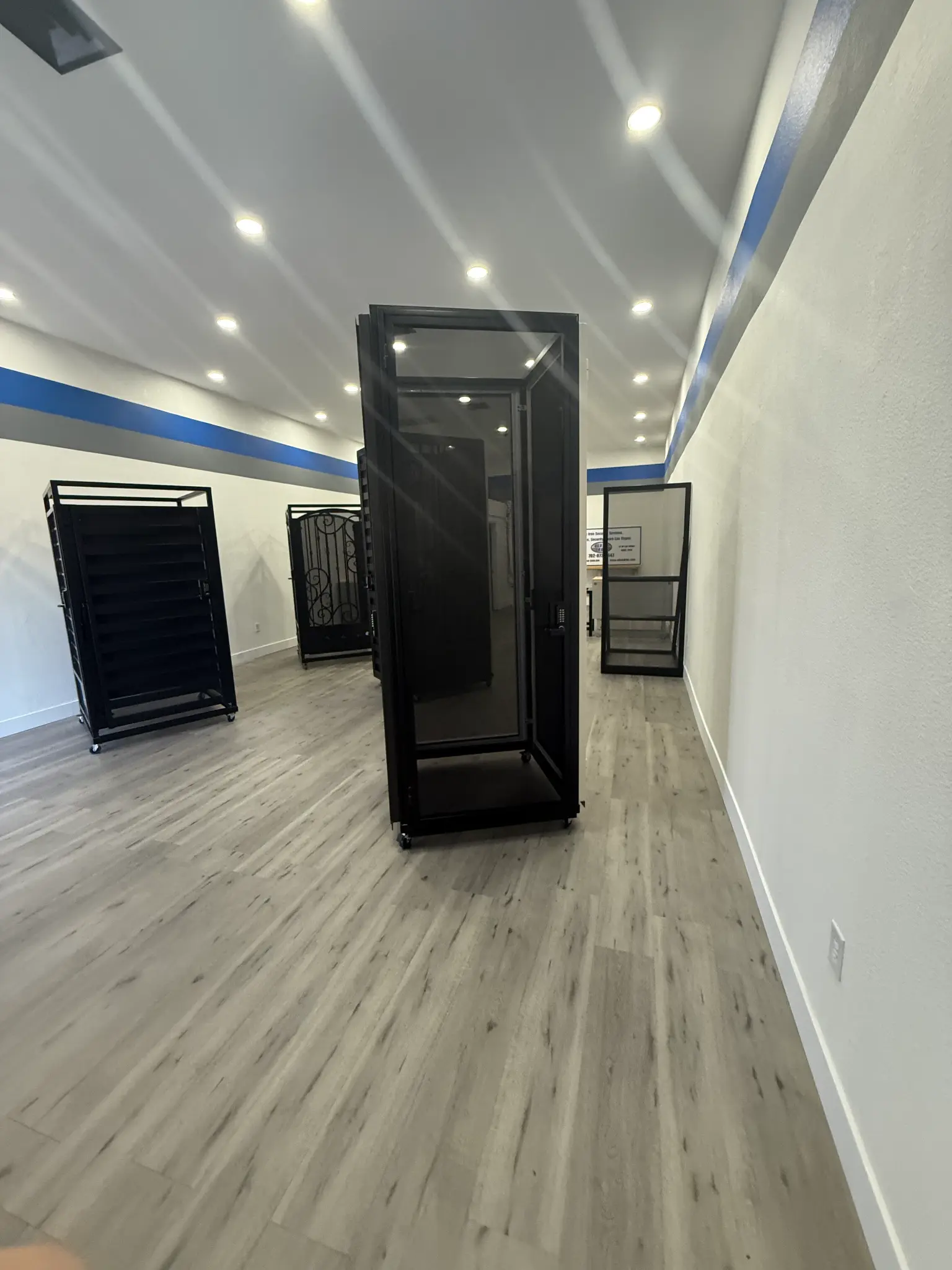 Black metal security screen display units in the Olson Iron showroom