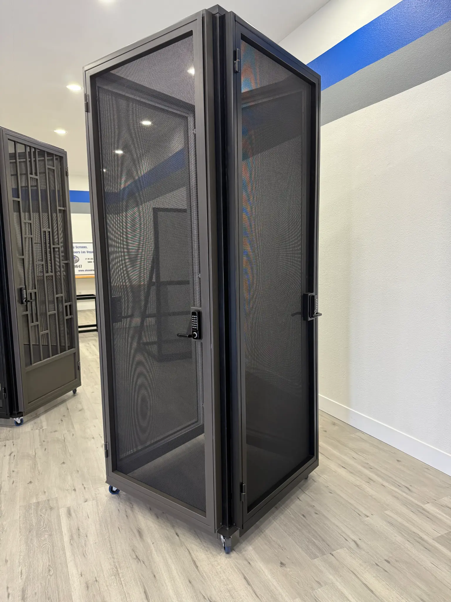 Security screen doors on display in the Olson Iron showroom