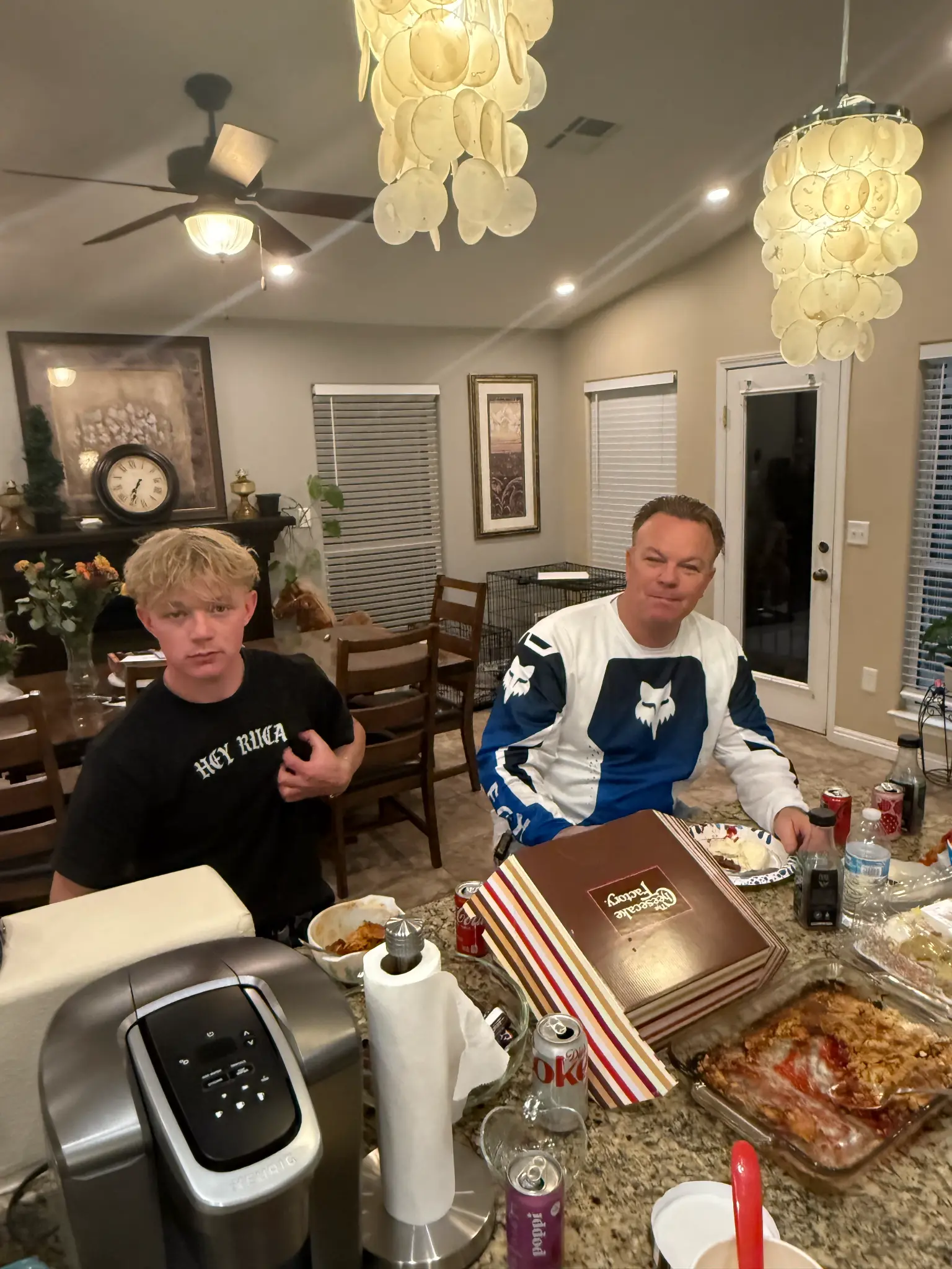 Two Olson family members at a kitchen gathering