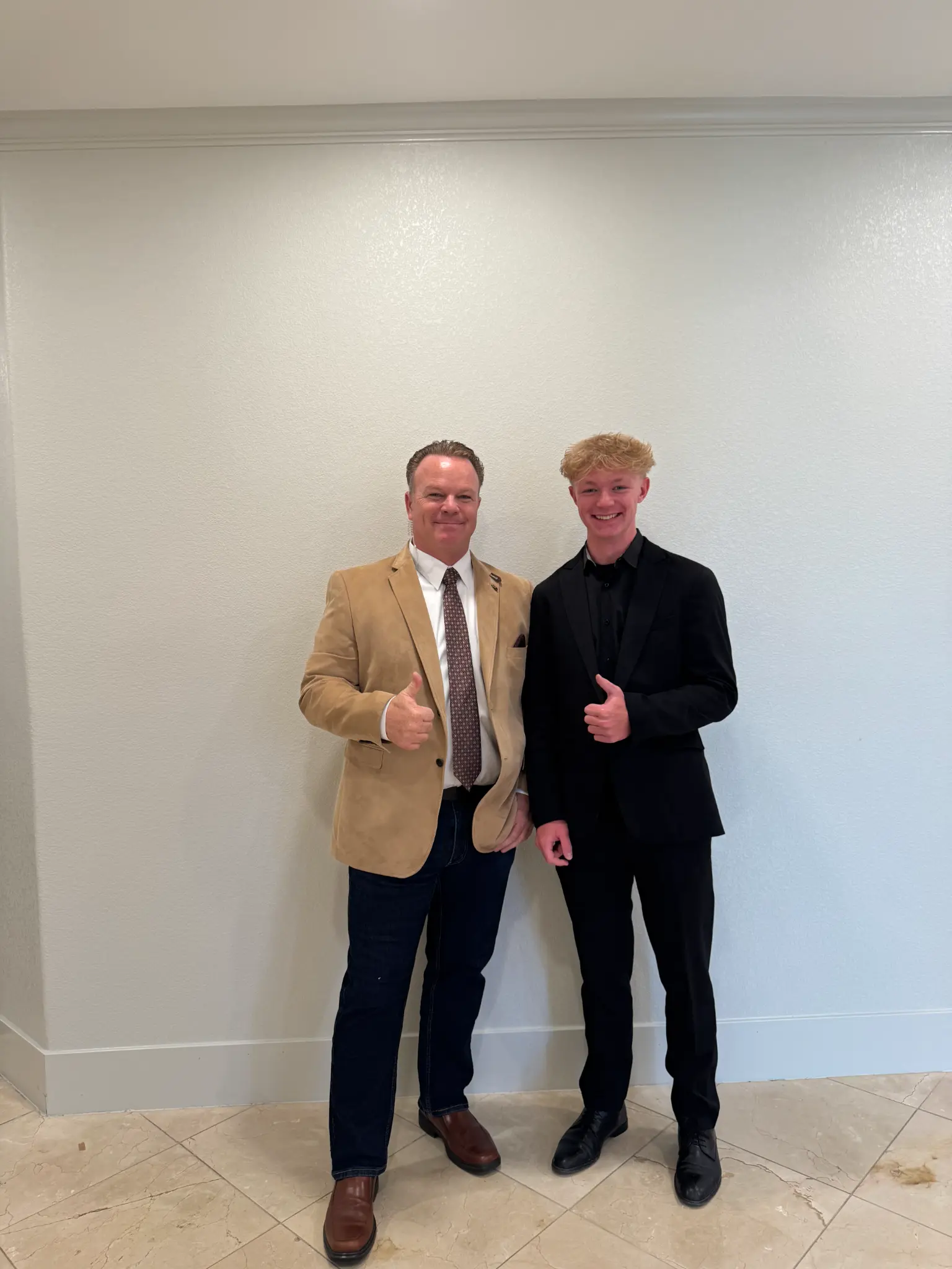 Two Olson family members in suits