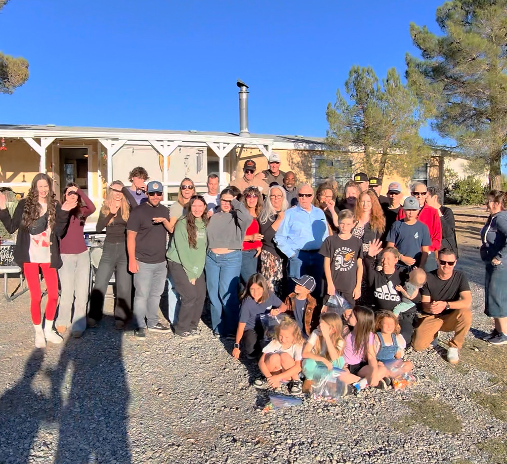 The whole Olson family gathered outdoors